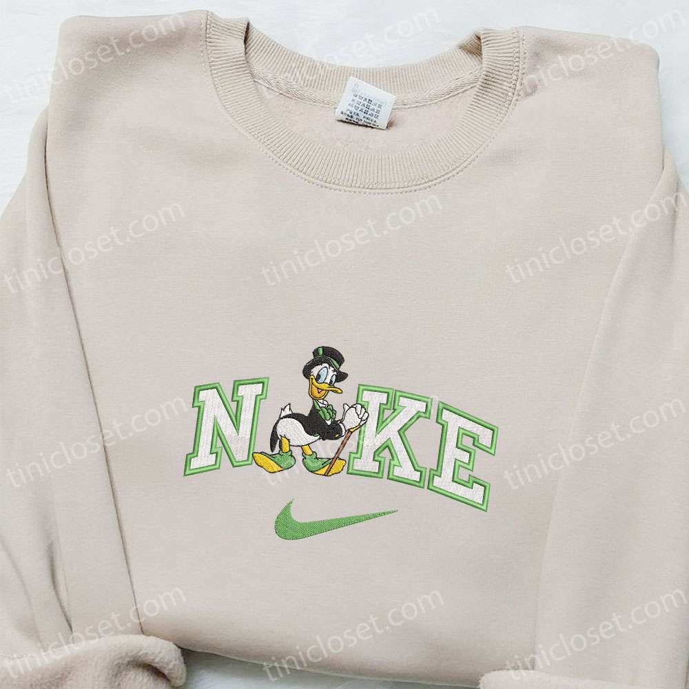 Donald Duck Shamrock Green X Nike Embroidered Shirt, Disney Characters Embroidered Shirt, Saint Patrick’s Day Embroidered Hoodie